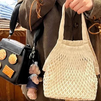 Новата плажна чанта за момичета, лятна слама въже, выдалбливают ръчно изработени чанти, ажурная чанта, дамски куха вязаная чанта Изображение